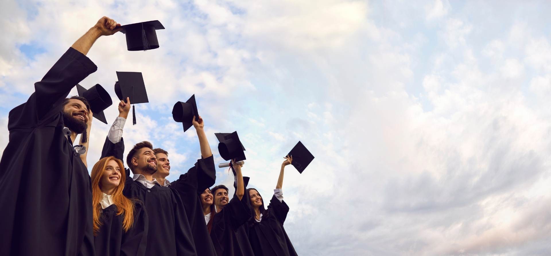 Graduates raising caps